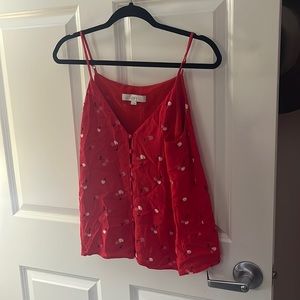 Red strappy blouse with cherries on it